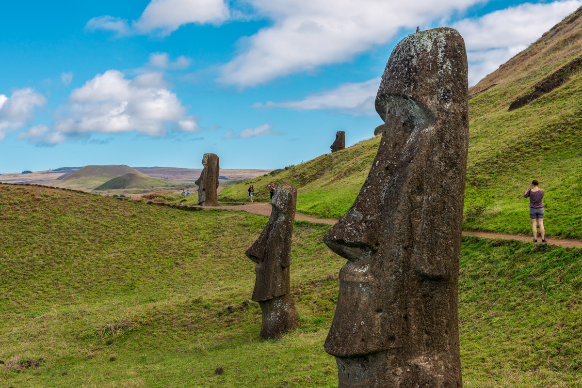 Humorous moai sculpture with pilot helmet